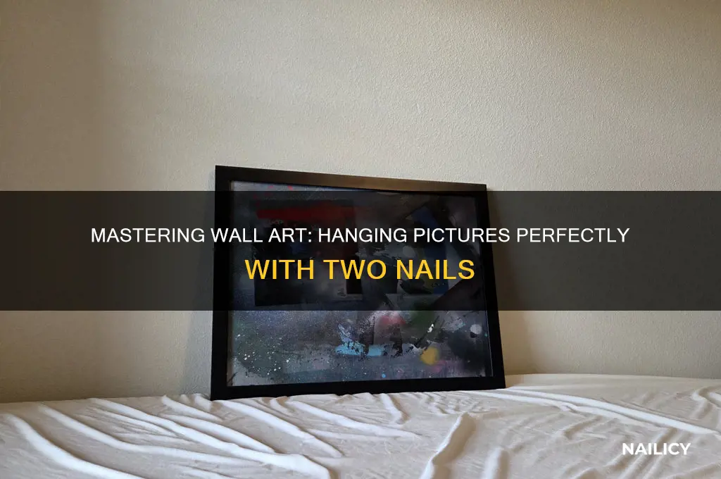 how to hang a picture with two nails