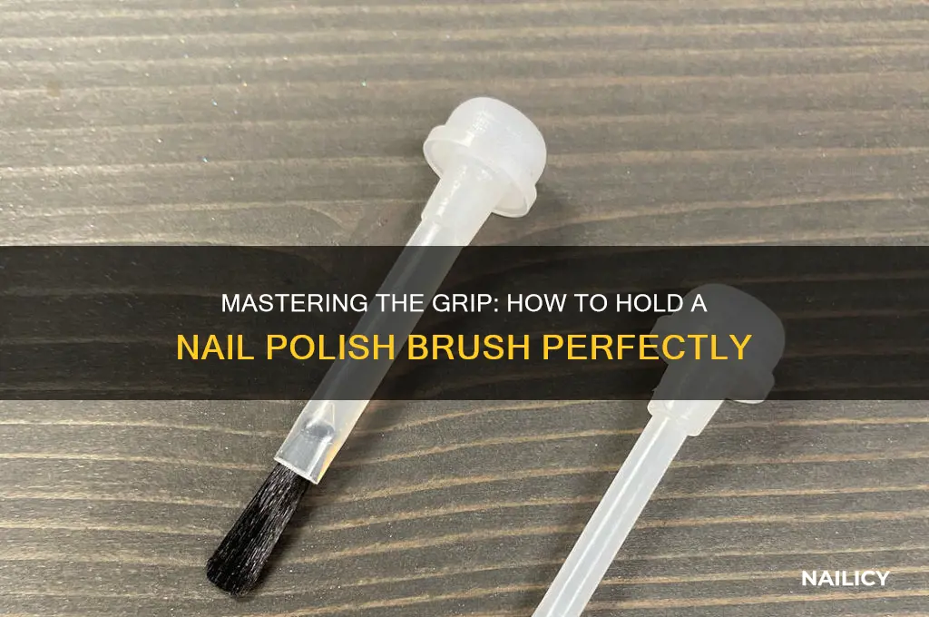 how to hold nail polish brush