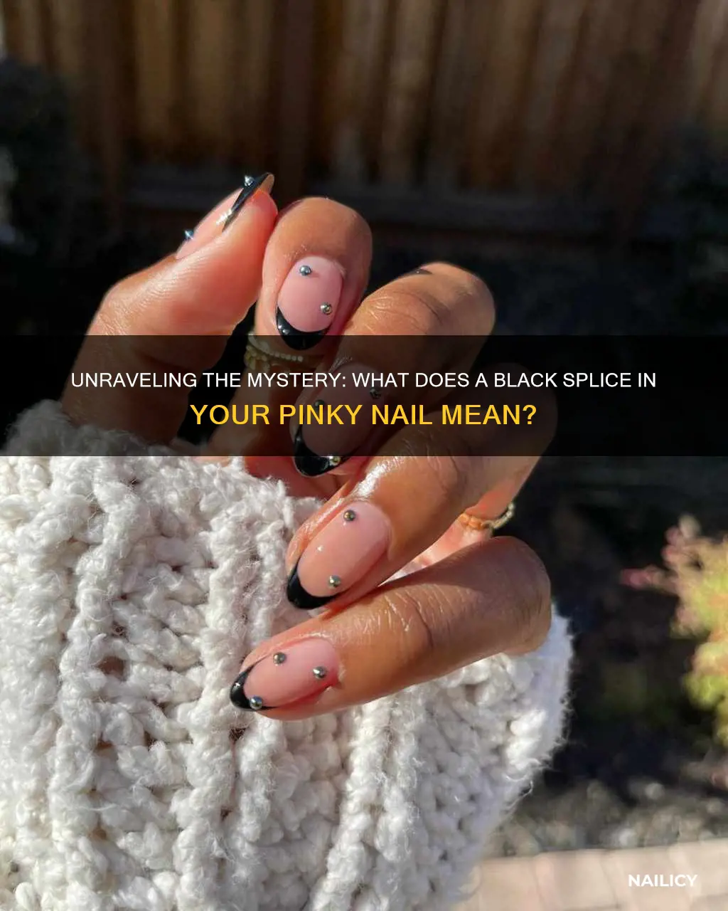 what dies a split in your pinky nail black mean