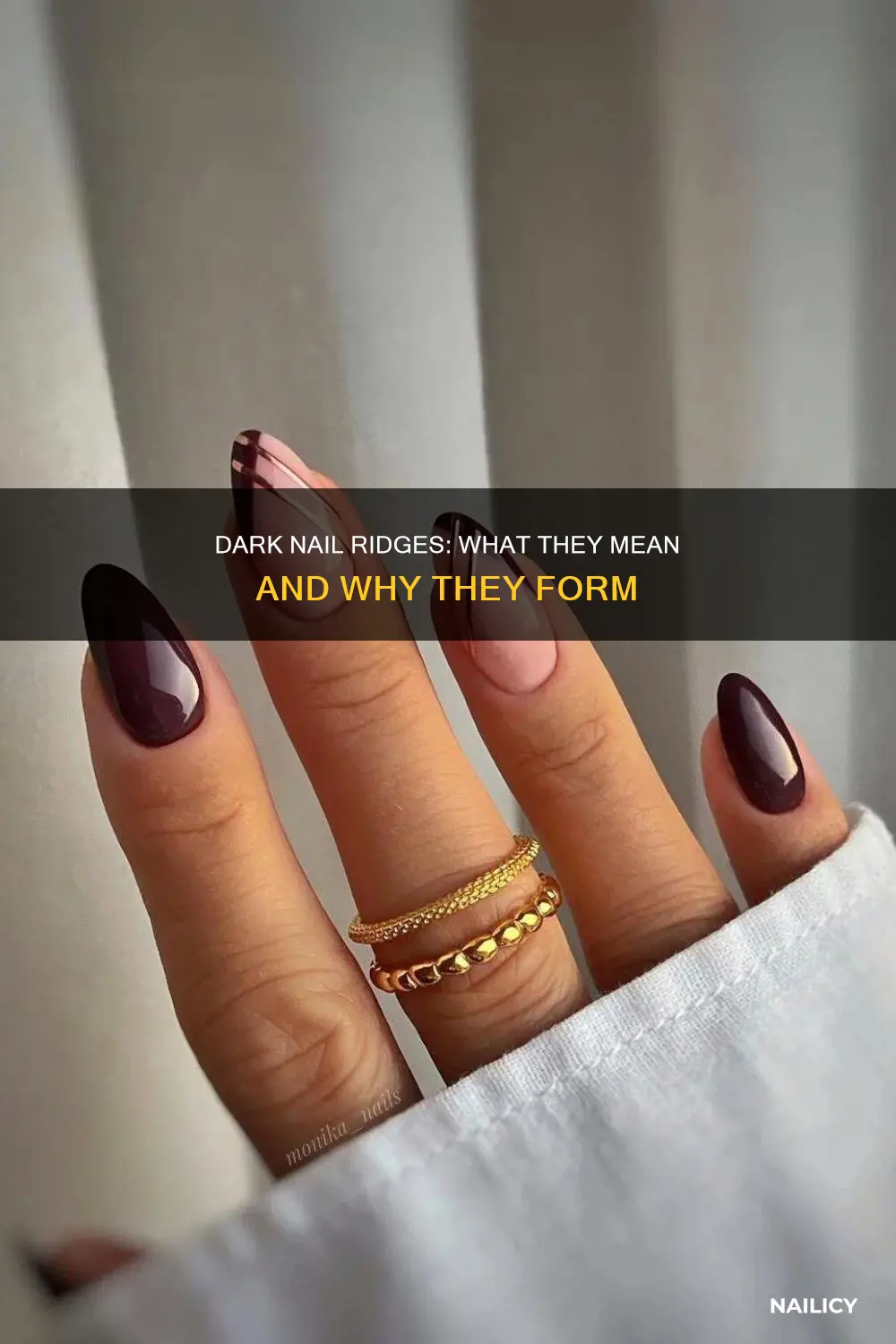 what does a dark ridge in your nail mean