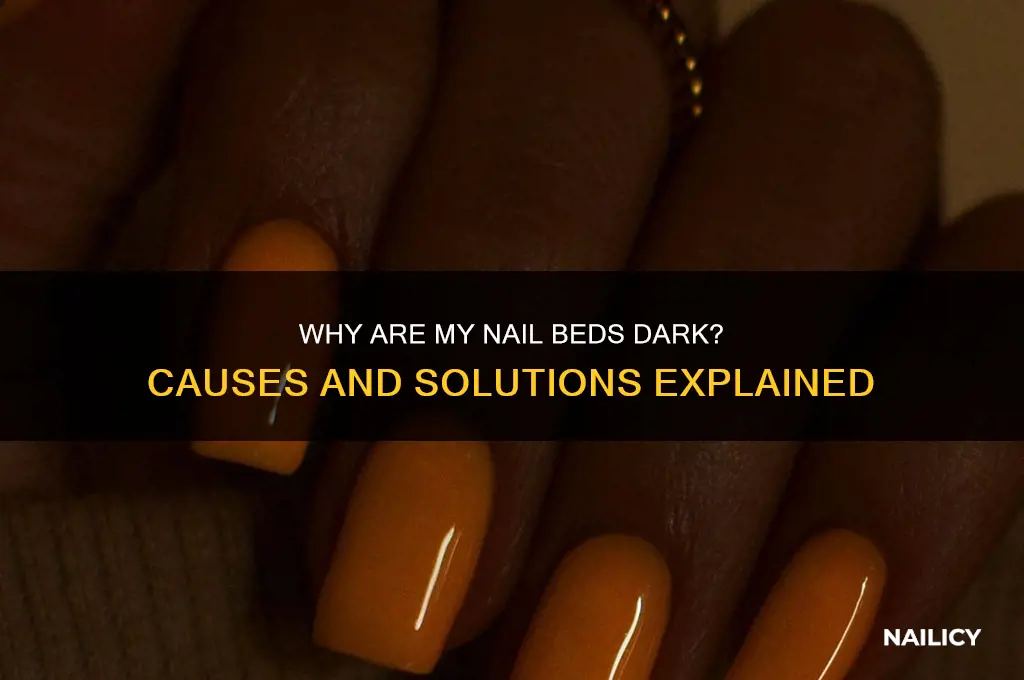 why is it dark under my nails