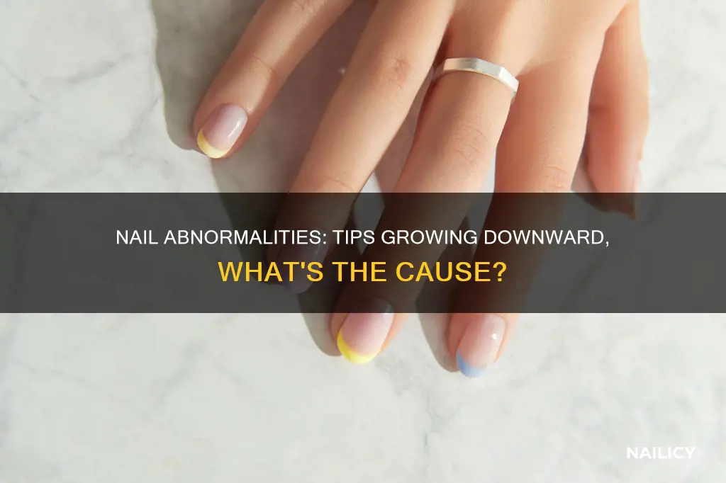 why is my nail tip growing down